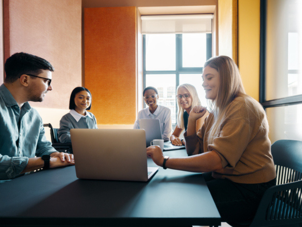 board members around a laptop