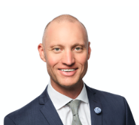 Trent Smyth wearing a suit and tie with a white background