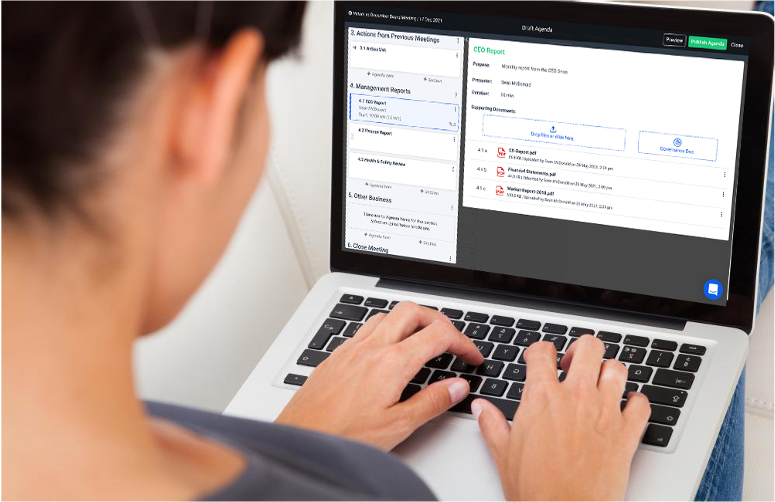 Woman on a laptop using BoardPro to build a board meeting agenda