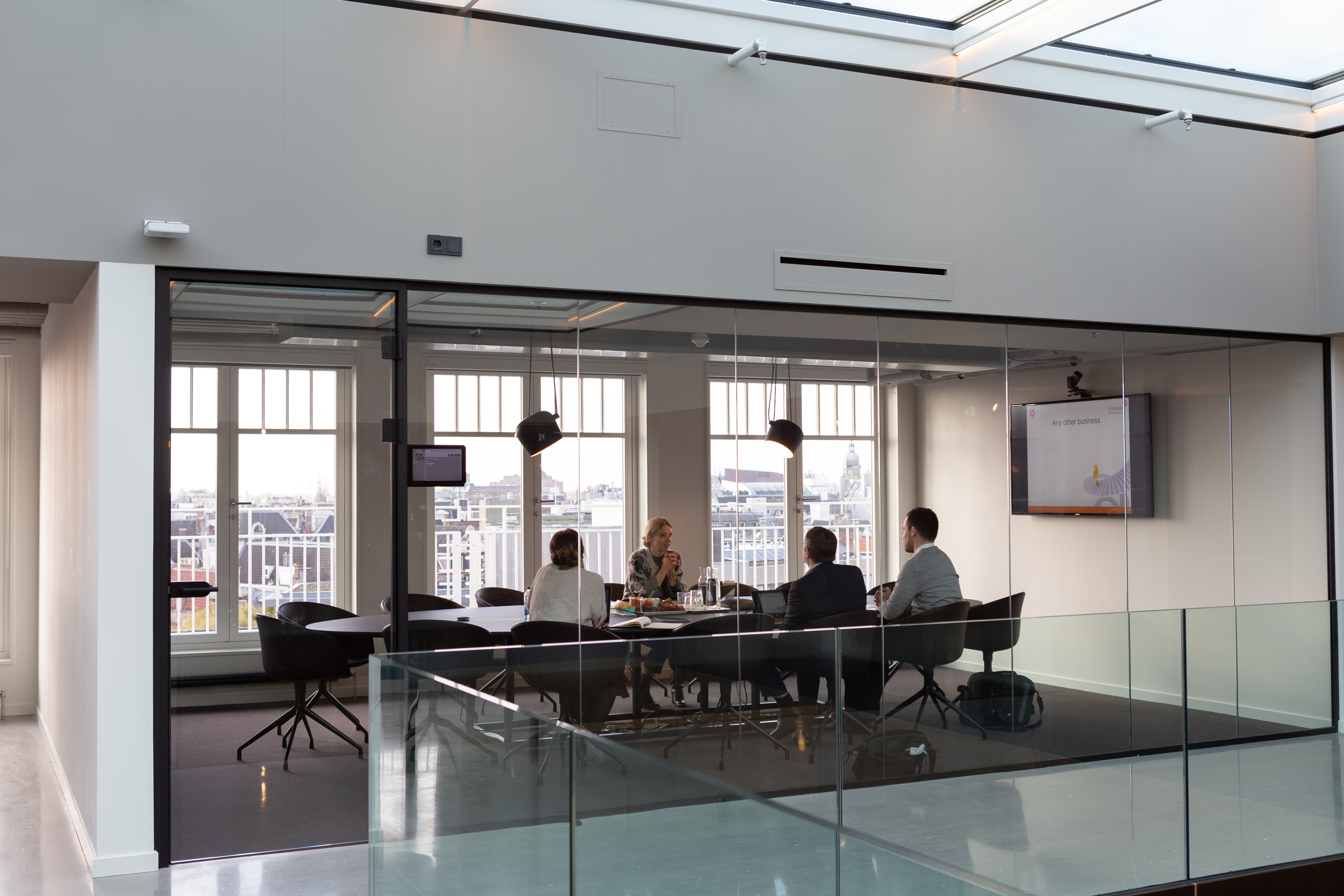 people sitting around a board table