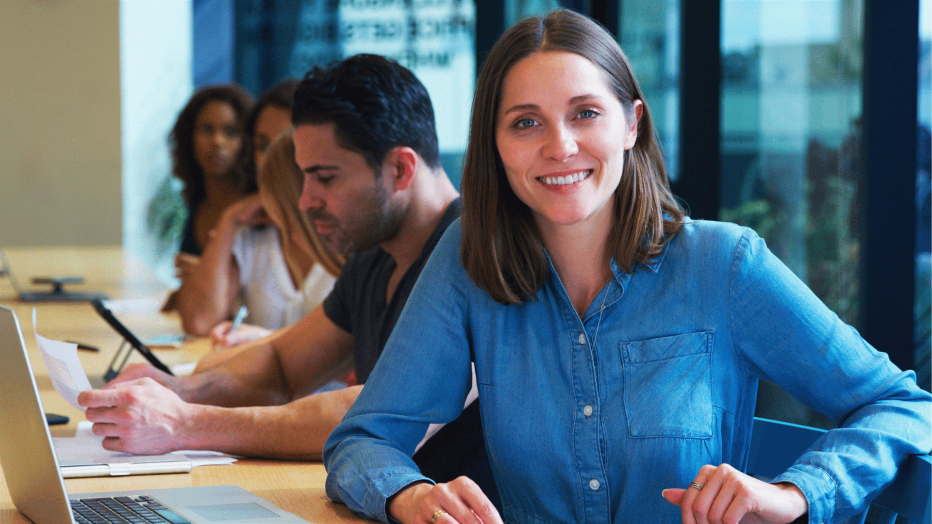 woman at a desk working on a consent agenda